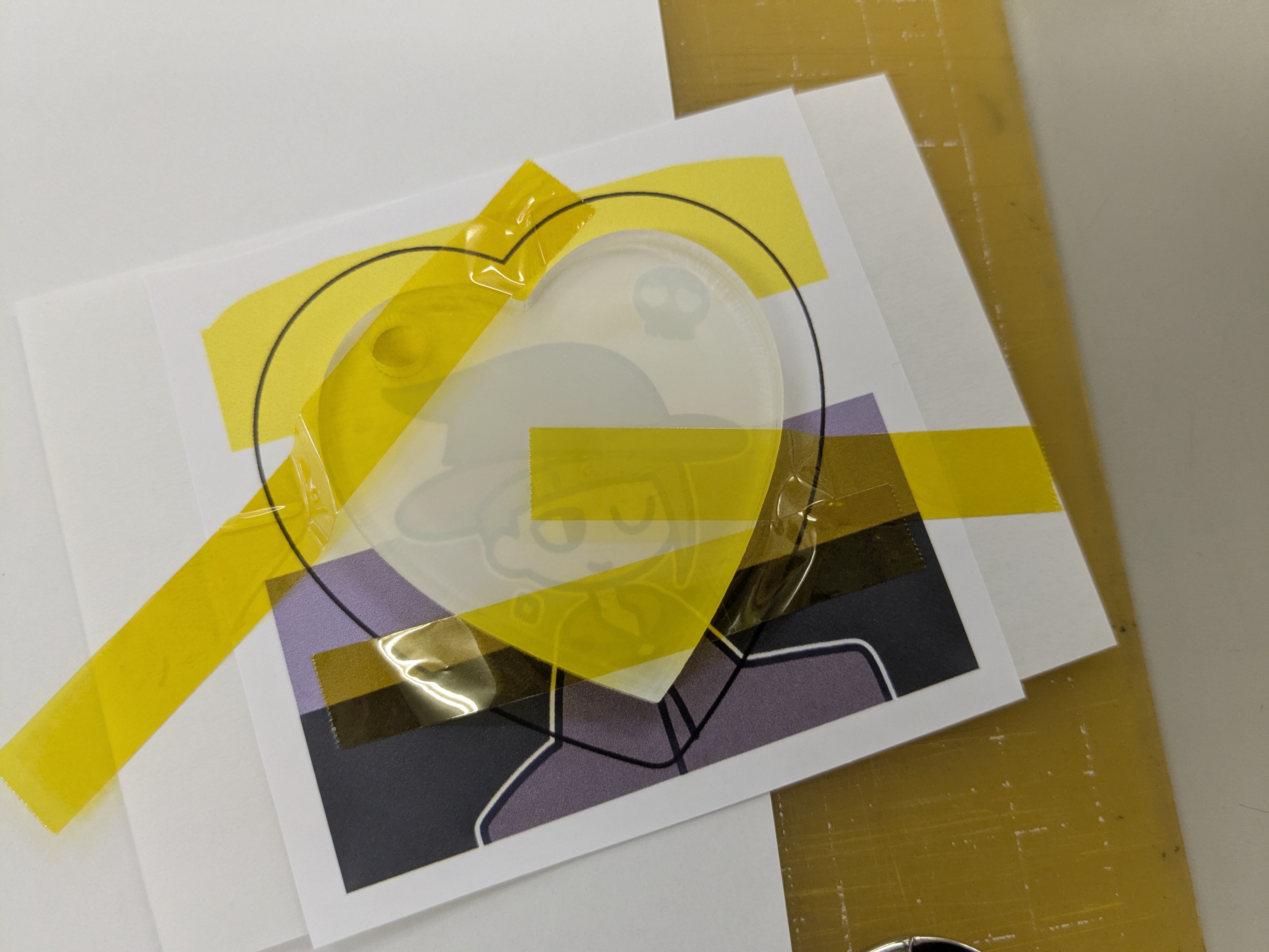 printed sheet with an acrylic heart on top