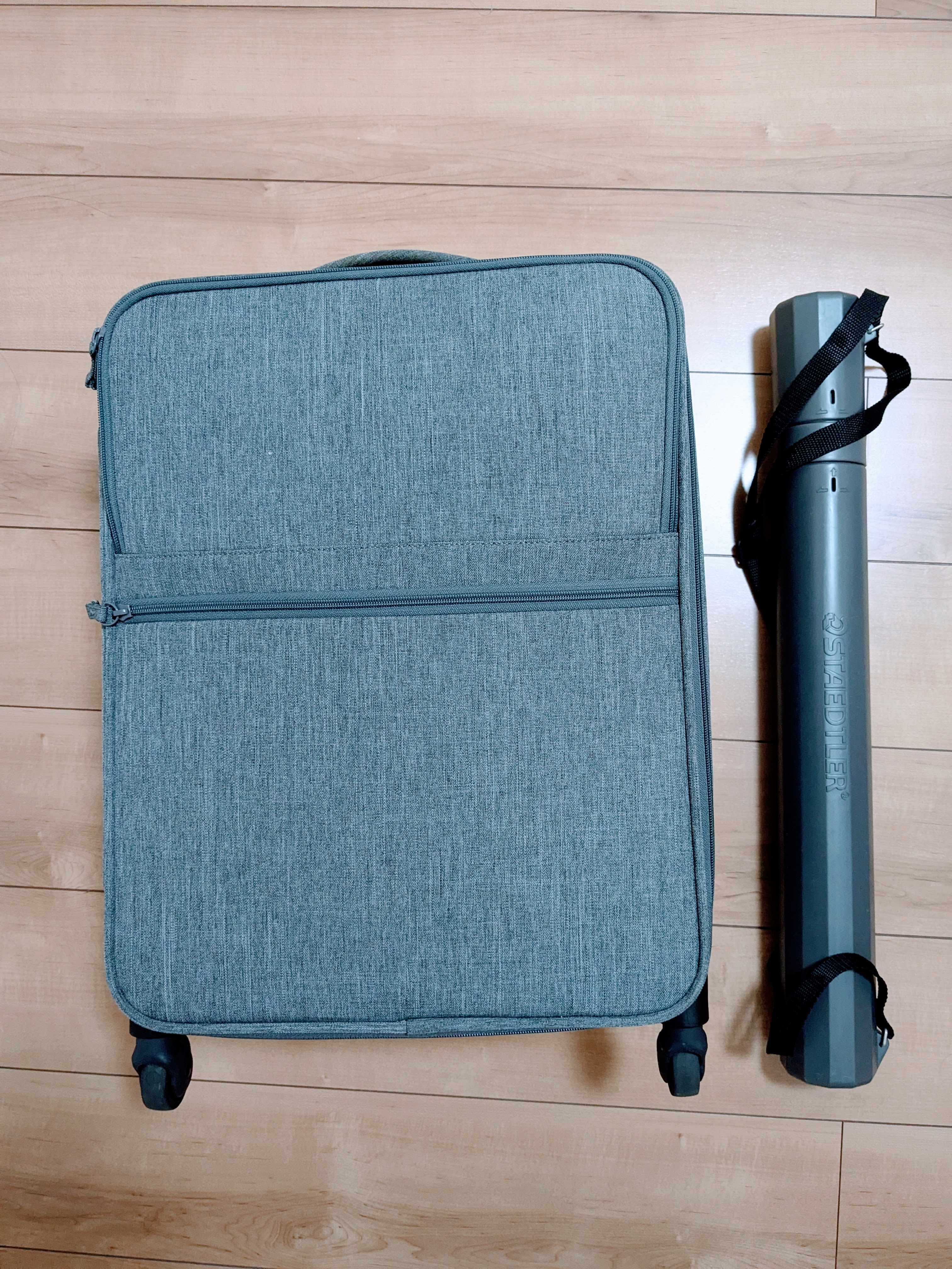 suitcase and poster tube